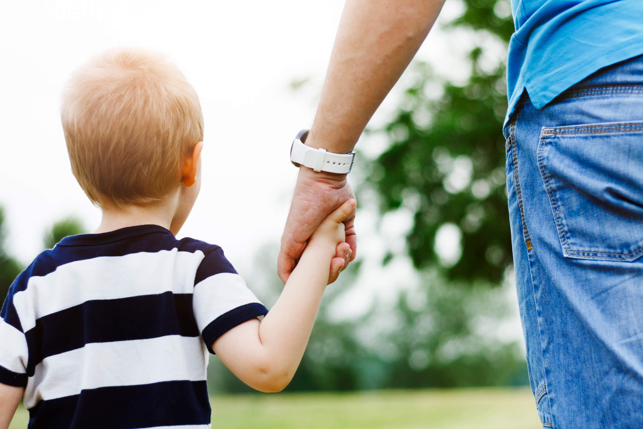 Father holding son's hand - Fathers' Rights in Oklahoma