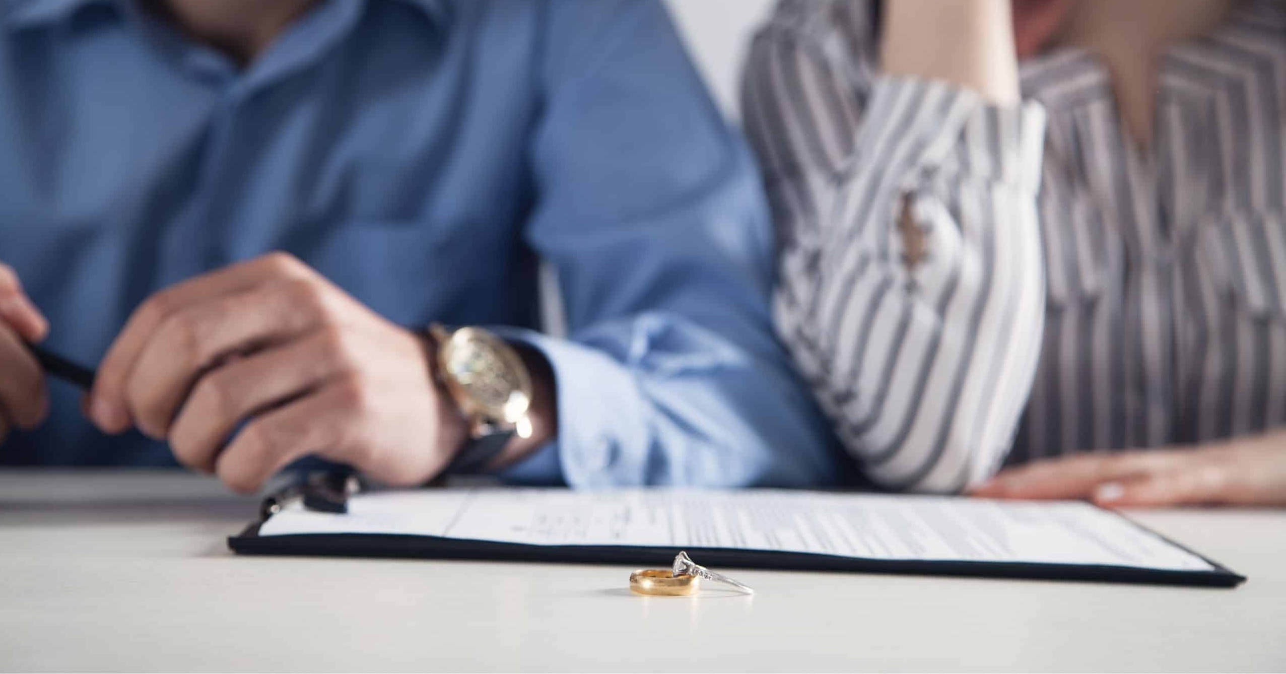 Divorced couple discussing and reaching an agreement on their finances